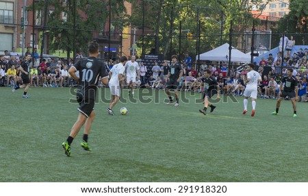 New York, NY USA - June 24, 2015: Team America (white) & team World (black) compete at soccer charity game at The 8th Steve Nash Foundation Showdown at Sarah D. Roosevelt Park