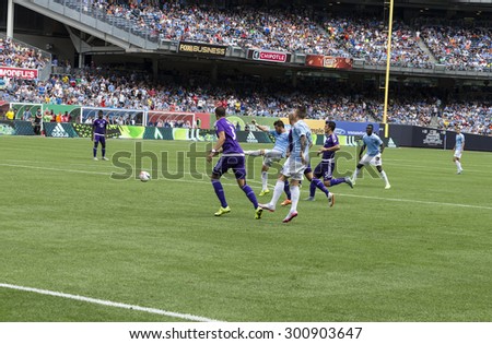 New York, NY - July 26, 2015: David Villa (7) scores goal during game between New York City Football Club and Orlando City SC at Yankee Stadium