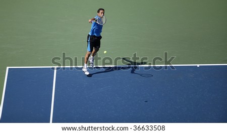 NEW YORK - SEPTEMBER 6: Nicolas Almagro of Spain returns a shot during match against Rafael Nadal of Spain at US Open on September 6, 2009 in New York.