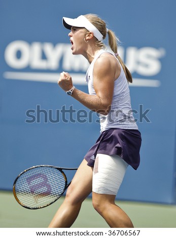 NEW YORK - SEPTEMBER 7: Melanie Oudin of USA celebrates a point during 4th round match against Nadia Petrova of Russia at US Open on September 7, 2009 in New York.