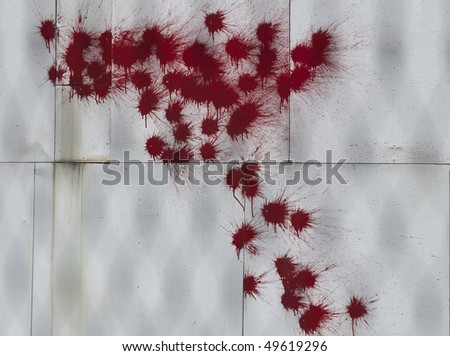 red paint on white billboard