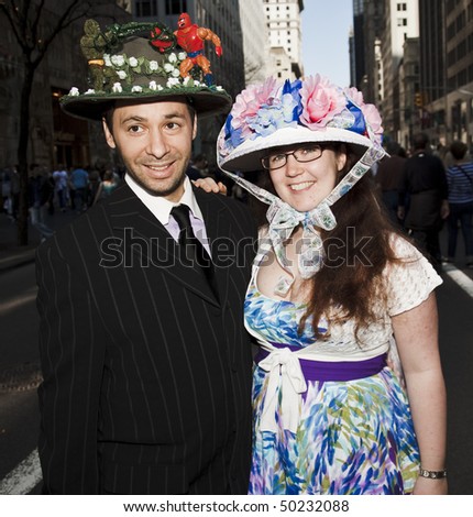 NEW YORK - APRIL 4: A couple partakes and shows off their hats in the Easter Bonnet Parade on 5th Avenue on April 4, 2010 in New York City.