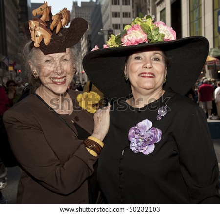 NEW YORK - APRIL 4: A couple partakes and shows off their hats in the Easter Bonnet Parade on 5th Avenue on April 4, 2010 in New York City.