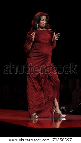 NEW YORK - FEBRUARY 09: Leila Ali in a Pea in the Pod dress walks runway for The Heart Truth\'s Red Dress Collection at Mercedez-Benz Fall/Winter 2011 Fashion Week on February 09, 2011 in New York City.