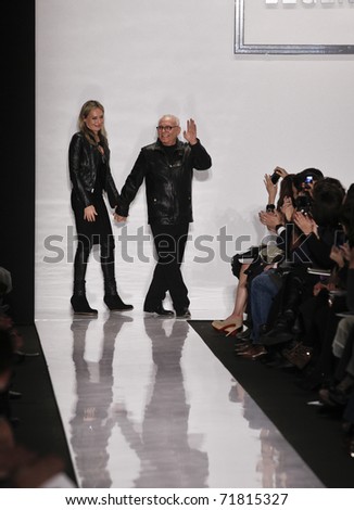 NEW YORK - FEBRUARY 15: Designer Max Azria (R) and Lubov Azria walk the runway for Herve Leger collection by Max Azria at Mercedes-Benz Fall/Winter 2011 Fashion Week on February 15, 2011 in New York City