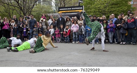 NEW YORK - APRIL 30: Members of break dancers \'Two Steps Away\' perform at the Family Festival Street Fair during the 2011 Tribeca Film Festival on Greenwich Street on April 30, 2011 in New York City