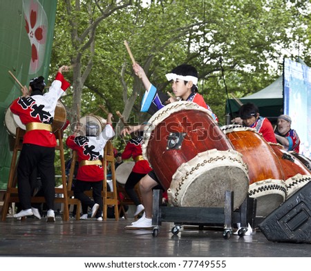 NEW YORK - MAY 22: Members of Japanese drum music groups NY Suwa Taiko Association & Soh Daiko perform as part of 5th annual Japan Day in Central Park on May 22, 2011 in New York City