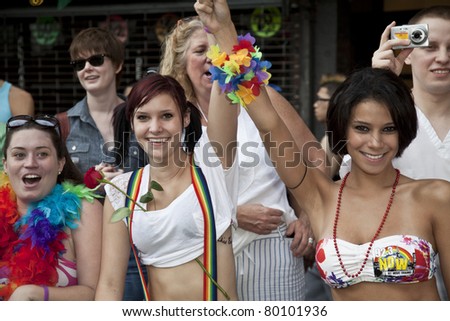 NEW YORK - JUNE 26: Unidentified revelers lined up along the march route during Pride march along Fifth Avenue at pride parade on June 26, 2011 in New York City.