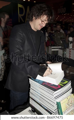 NEW YORK - OCTOBER 15: Author Jeff Smith signs autograph during New York Comic Con 2011 in Javits Center on October 15, 2011 in New York.