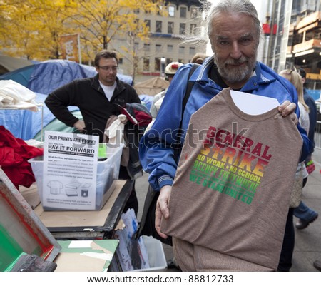 NEW YORK - NOVEMBER 14: Unidentified protester with \'Occupy Wall Street\' prints on t-shirts in exchange for donations on November 14, 2011 in New York.