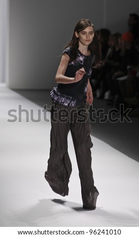 NEW YORK - FEBRUARY 09: Model loses balance on runway for collection by Richard Chai during Fashion week at Lincoln Center in Manhattan on February 09, 2012 in New York City
