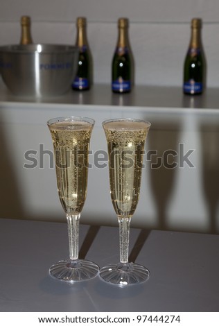 NEW YORK - MARCH 10: Flutes with Pommery champagne on sale at The Armory Show at Piers 92 & 94 on March 10, 2012 in New York City