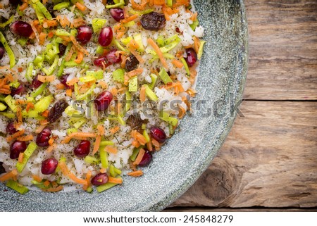 Rice dish. Pomegranate with raisins. Vegetarian food.