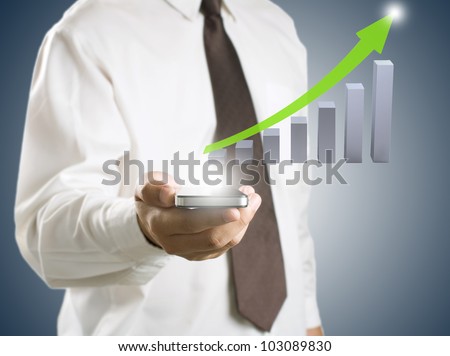 Business man showing smart phone with growth graph in background