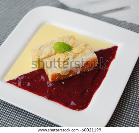 delicious cake with strawberry and cream sauce