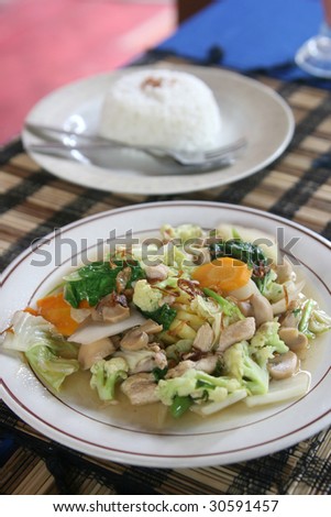 A simple chinese meal with rice, chicken and vegetables