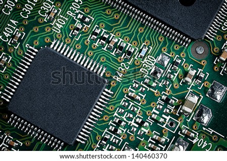 Close up detail of green microchip circuit board.