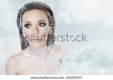 portrait of a girl in a blizzard of snow that looks like a snow queen