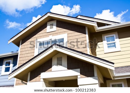 Fragments of a nice houses with blue sky on background