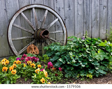 An old wagon wheel makes a great prop in the garden!