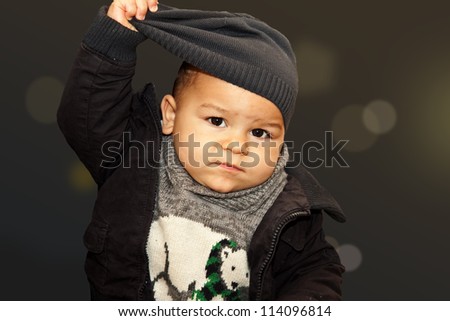 cute boy portrait putting his hat off