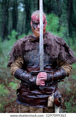 Similar – Image, Stock Photo Bloody real viking with his sword training for combat