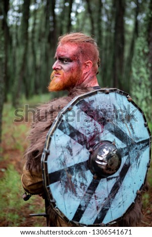 Similar – Image, Stock Photo Bloody real viking with his sword training for combat