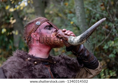 Image, Stock Photo Bloody real viking with his sword training for combat