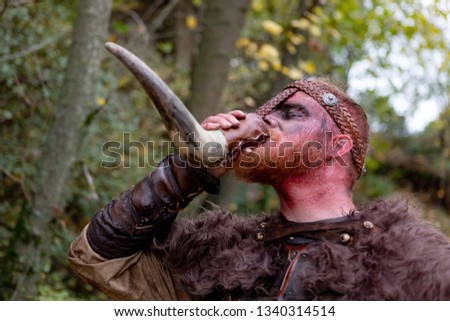 Similar – Image, Stock Photo Bloody real viking with his sword training for combat