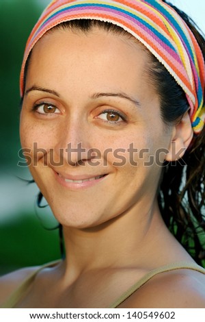Beautiful portrait of a brunette woman with a nice light on face