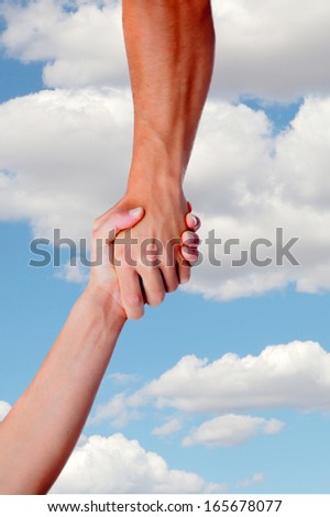 Strong arm assisting on a sky with clouds background
