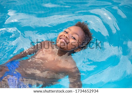 Similar – Image, Stock Photo Black boy swimming in pool