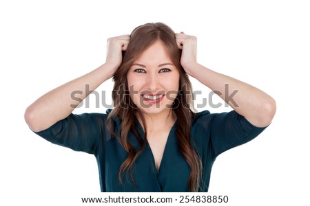 Surprised and worried young woman isolated on a white background