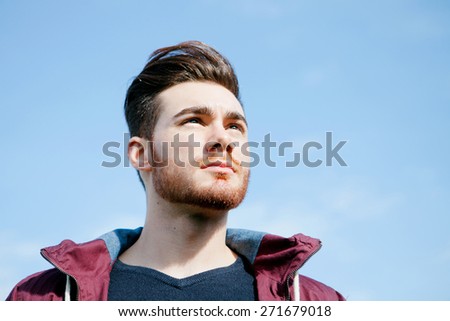 Portrait of casual cool young man with beard