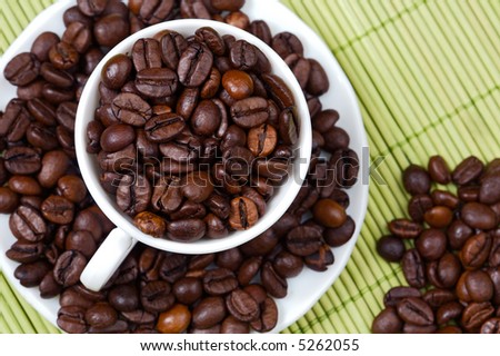 Coffee beans in a cup - focus in the frist plane -