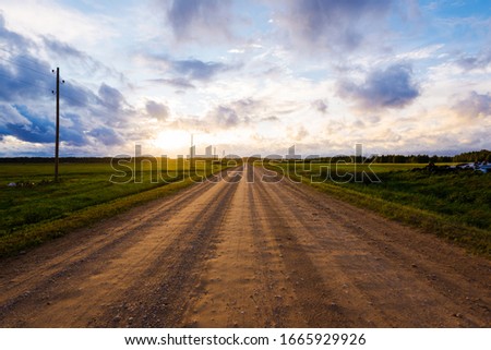 Similar – Foto Bild Ländlicher Feldweg durch frühlingsgrüne Felder. Ländliche Abendszene