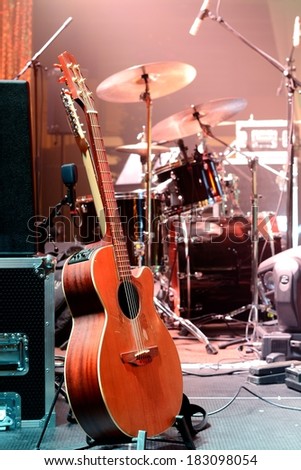 Guitar and other musical equipment on stage before concert