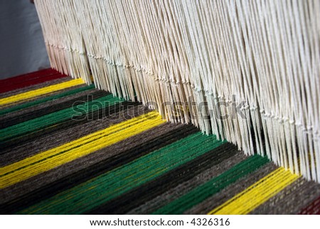 handcraft knitting machine detail of wool threads