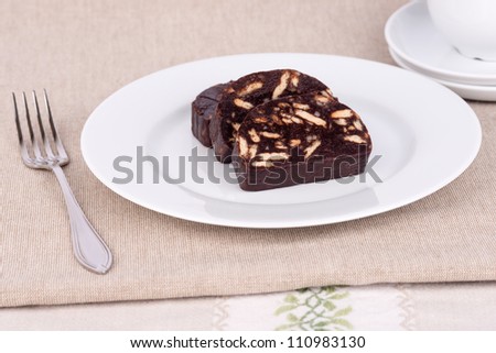 Brown chocolate cake with biscuits and sugar.