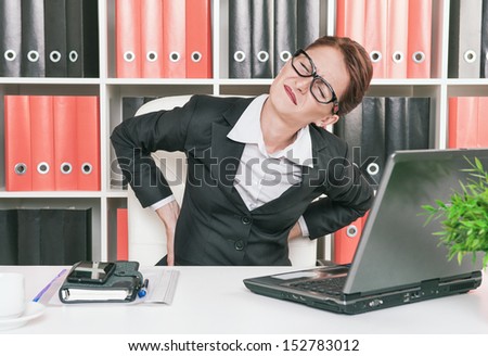 Business woman with pain in her back