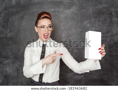 Woman pointing on empty box in her hand
