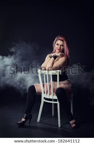 Beautiful woman sitting on the chair