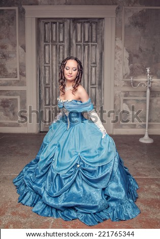 Beautiful medieval woman in blue dress