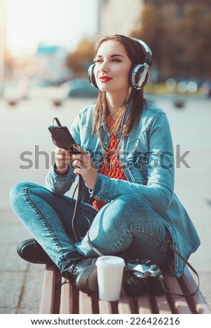 Hipster beautiful girl listening music