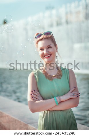 Happy beautiful young girl with braces in vintage clothing outdoor