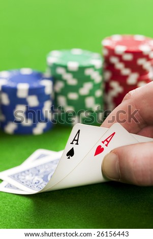Playing poker in the casino with winning hand