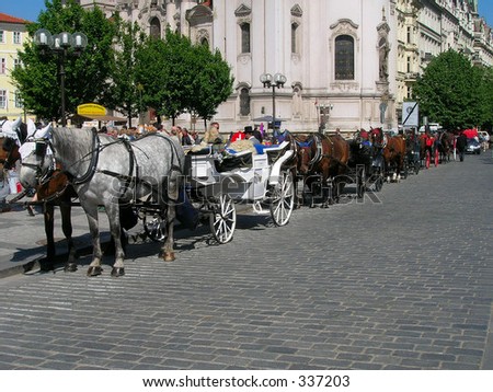 Row of carriages pulled by horses