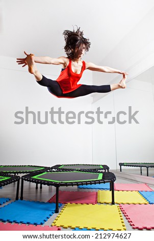Jumping young woman on a trampoline