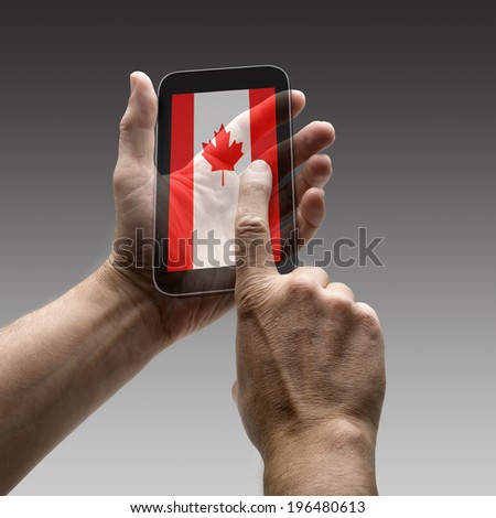 Holding canada flag screen smart phone. There is a route for hand and finger.