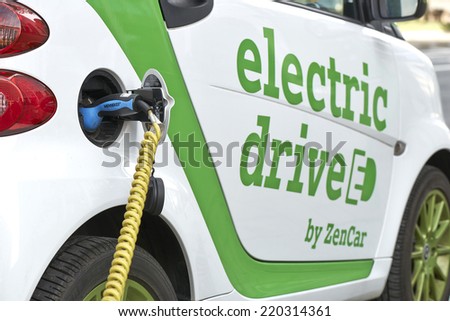 BRUSSELS, BELGIUM - SEPTEMBER 28, 2014: Zen Car Europe\'s first electric car to rent on Bld Botanique in front of the Financial tower on September 28, 2014 in Brussels, Belgium